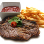 Chuleta de cerdo con patatas fritas